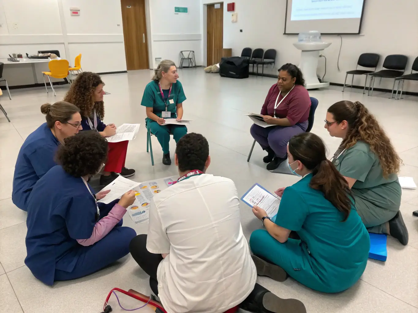 A Just Lean On Me, LLC employee attending a professional development workshop, focused on advanced care techniques. The setting is a modern training facility, emphasizing the company's investment in employee growth.